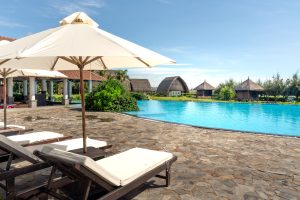 Experience a tropical paradise at this luxurious resort with a stunning pool and relaxation area. — Holiday to Malta - Greate